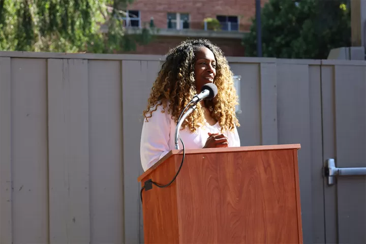 Davida Johnson at an outdoor podium